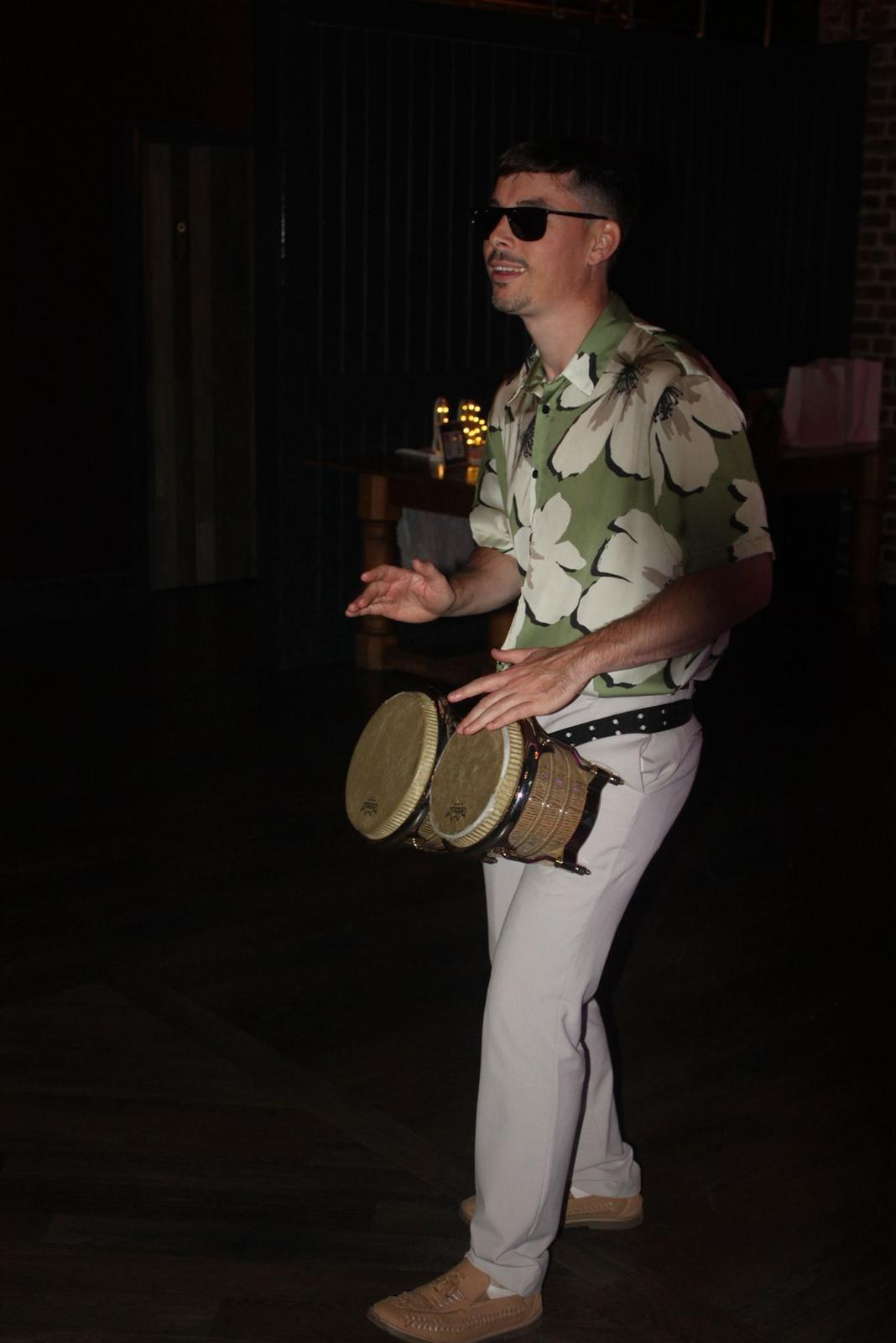 James with bongos by the sea