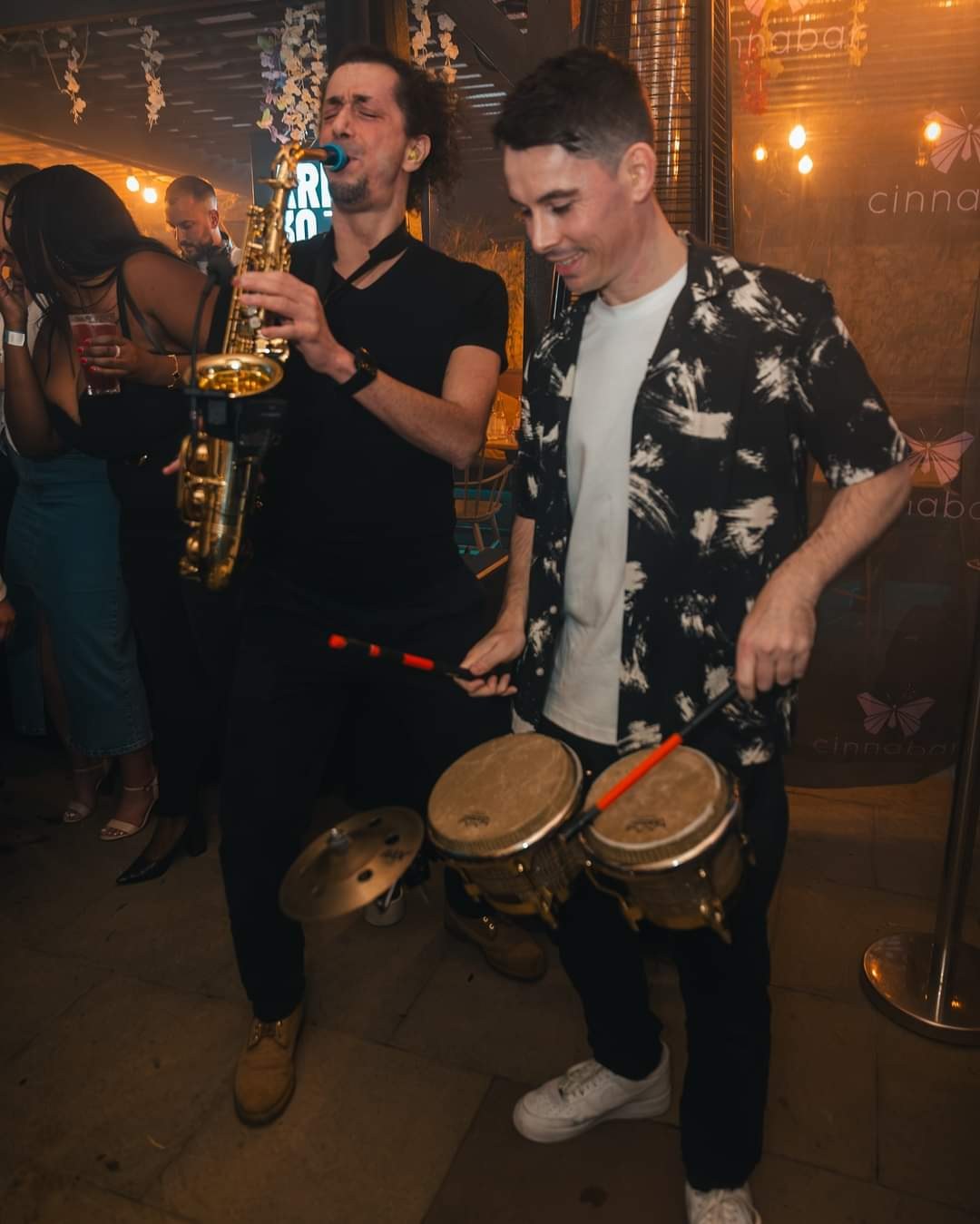 James performing percussion at night